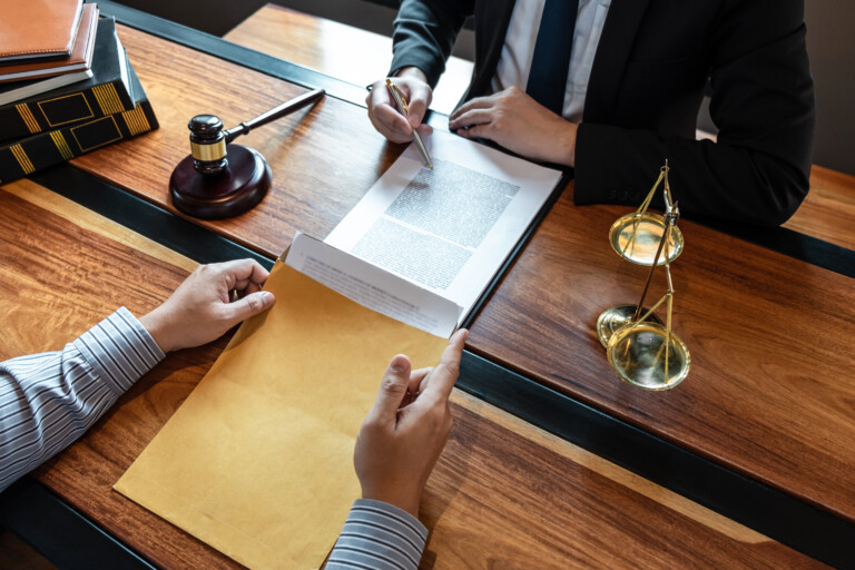 Male,Lawyer,Discussing,Negotiation,Legal,Case,With,Client,Meeting,With